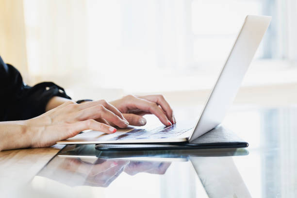 istock Hands of woman using laptop 1158835479