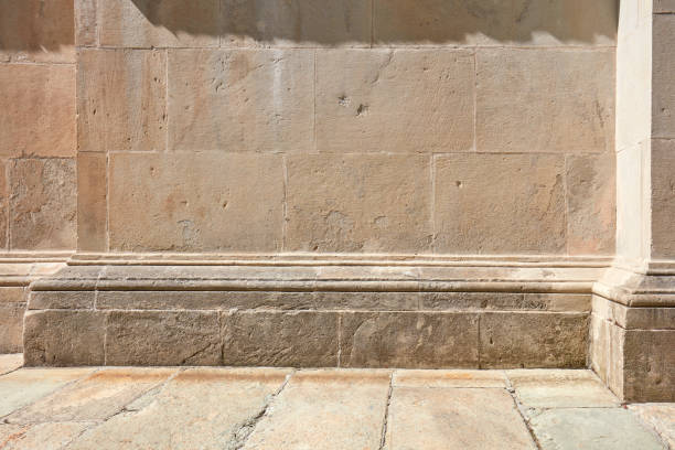 istock Old stone wall with molding and floor background in sunlight, nobody 1158836633