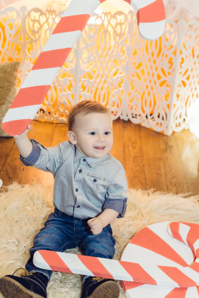 istock New Year decorations near the fireplace, a small child 1158836676