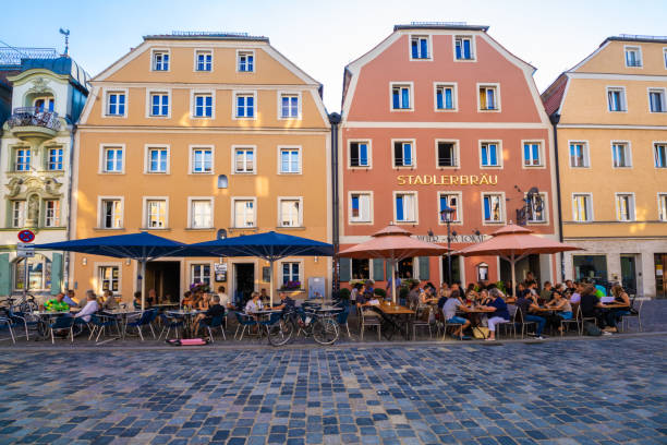 Regensburg, Germany - July 18, 2018: Regensburg city life. People sitting in the restaurant, having a break.