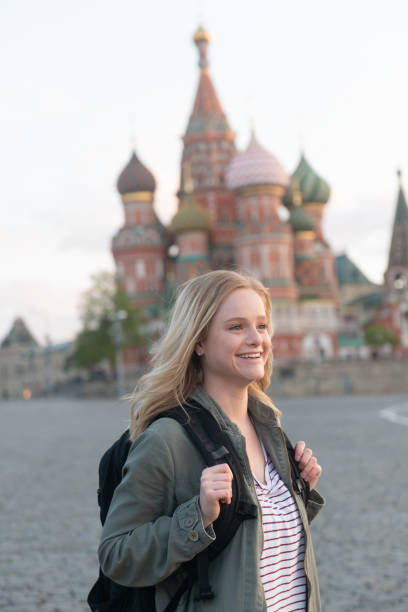 istock Smiling woman in Red Square 1158843504