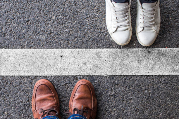 istock Man and woman divided by a line 1158843574