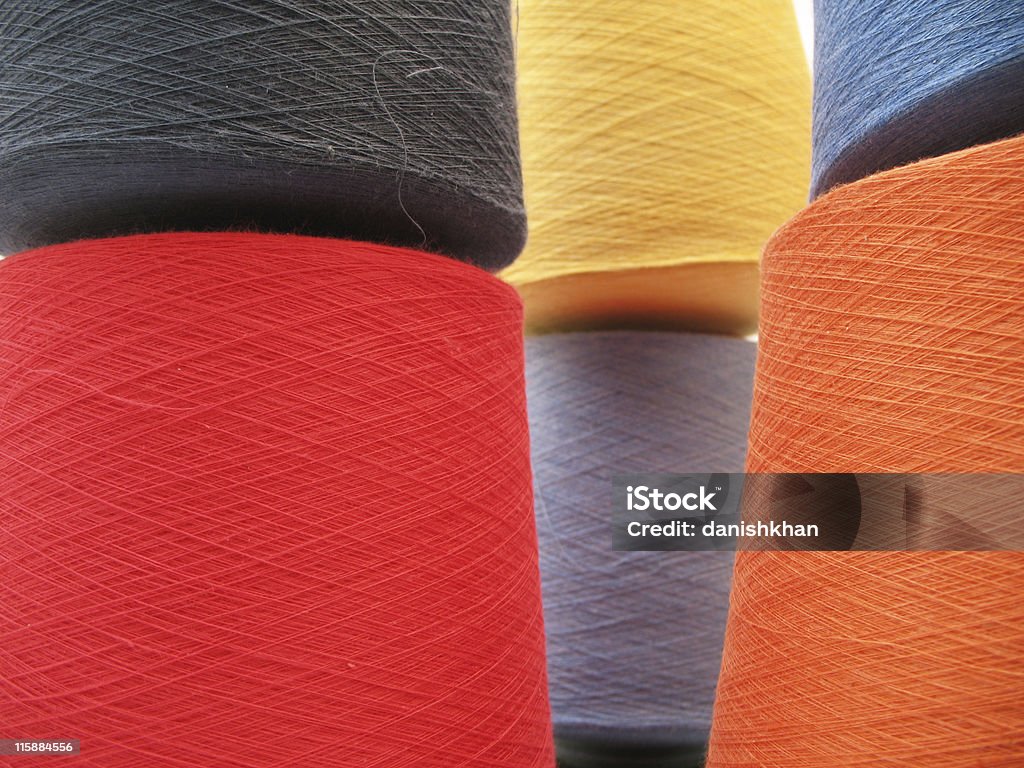 Fast Colors Cotton yarn cones in mix color shades, (this are 100% cotton yarn) with copyspace. Ball Of Wool Stock Photo