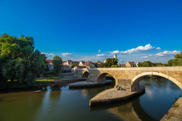 istock Danube river and famous Old Stone Bridge. Regensburg, Germany 1158845834