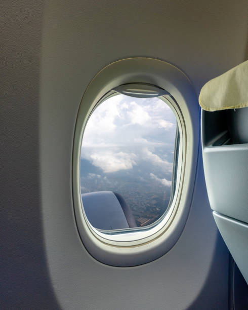 istock Airplane wing flying above the clouds 1158846609