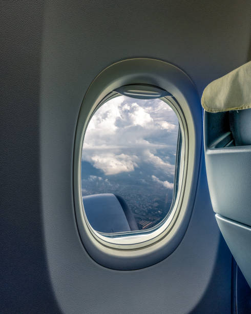 istock Airplane wing flying above the clouds 1158846646