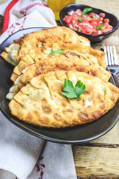 istock Homemade fried empanadas with tomato sauces. 1158847633