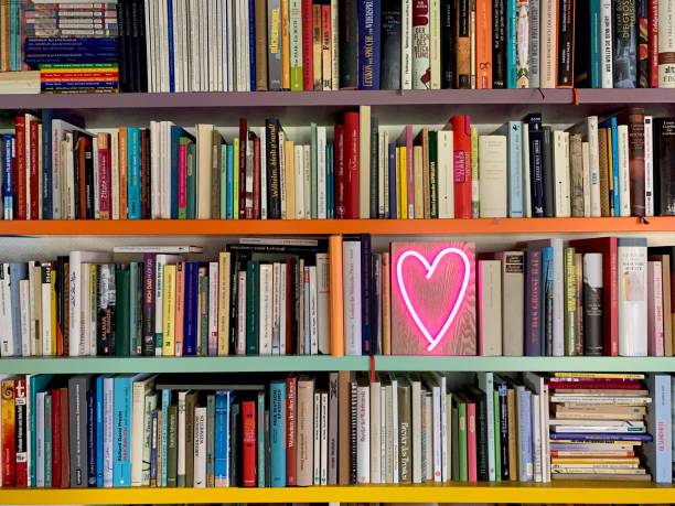 istock Books shelves packed with books and a neon heart shape 1158847652