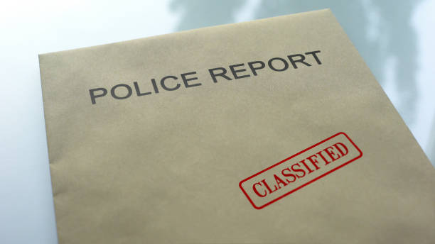 istock Police report classified, seal stamped on folder with important documents 1158848862