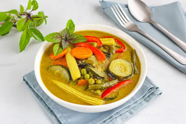 Thai Green Vegetable Curry on White Background. Authentic Thai Food Photography.