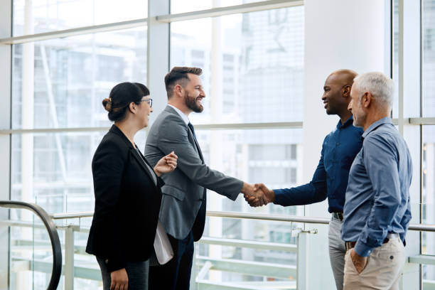istock We're joining forces to achieve combined success 1158854727