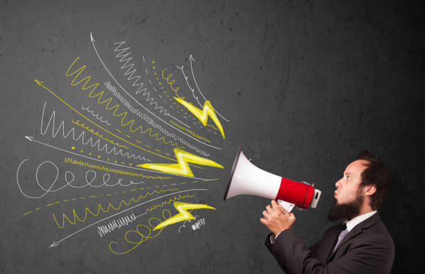 istock Leader guy shouting into megaphone with hand drawn lines and arrows 1158855093