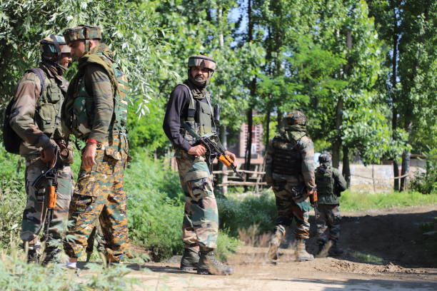 Encounter between militants and Security forces in Kashmir A fierce Gun-Battle erupted between Militants and Indian Security forces at  Gund Checkpora of Budgam in Central of Kashmir, One JEM militant was Killed when a Gun-Battle between militants and Government forces broke early morning in Budgam Village south of Kashmir. Police said. militant groups photos stock pictures, royalty-free photos & images