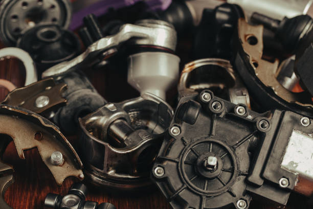 istock Various car parts on dark woooden background 1158857552