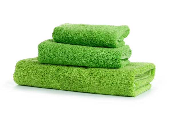 A stack of towels green on a white background