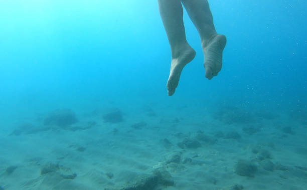 istock Woman swims in clear Mediterranean water 1158859010