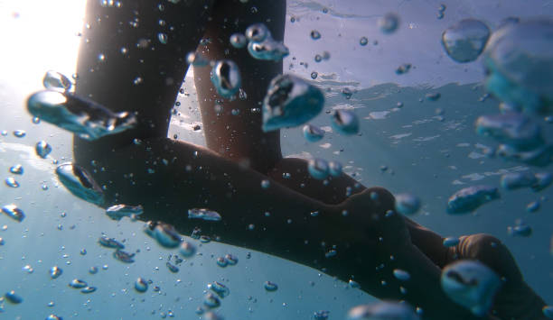 istock Woman swims in clear Mediterranean water 1158859016