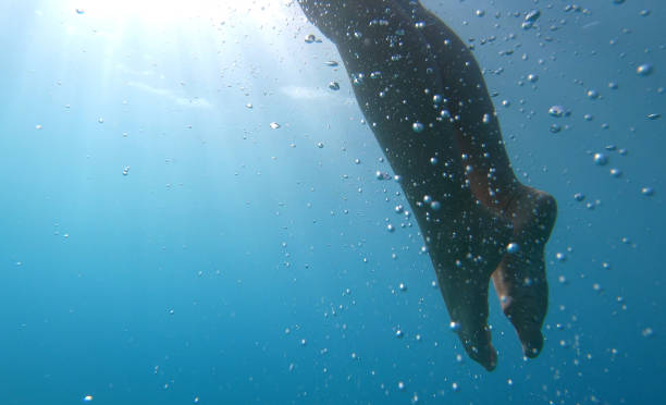 istock Woman swims in clear Mediterranean water 1158859021