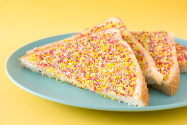 Traditional Australian fairy bread on yellow background