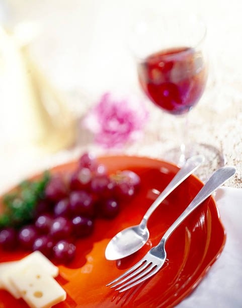 istock Dramatic shot of plate, utensils, cheese and grapes 115885990