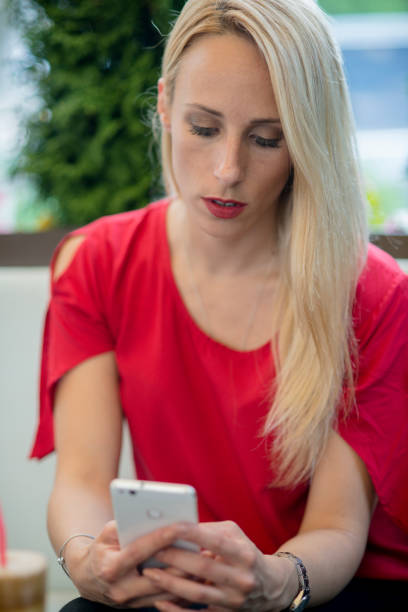 istock Young Woman using her smart phone 1158862068