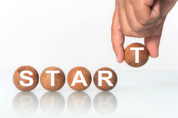 istock Hand putting on Wooden ball 1158863637