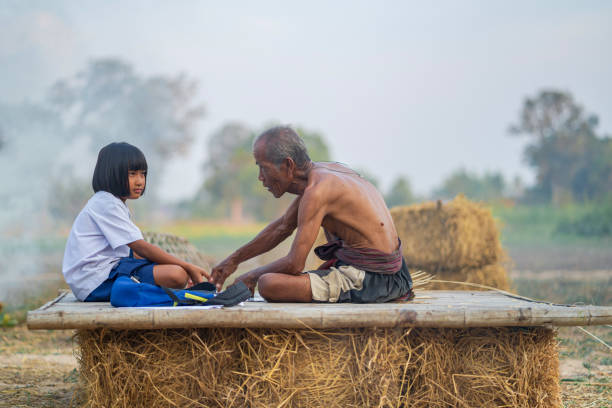 istock Senior man and bamboo craft with student girl 1158866724