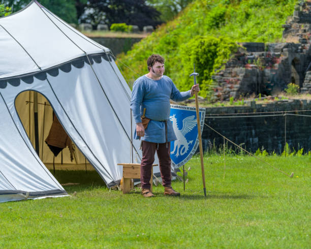 istock Medieval armorer stands by his shield. 1158870436