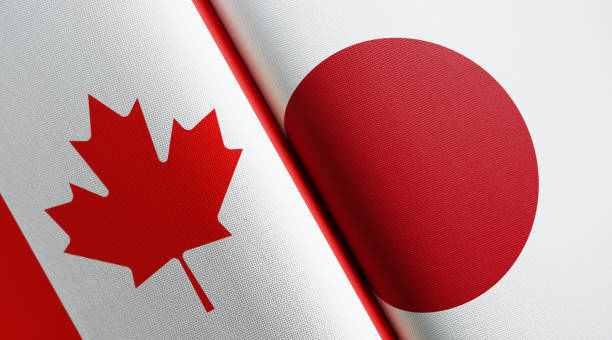 istock Canadian And Japanese Flag Pair 1158872435