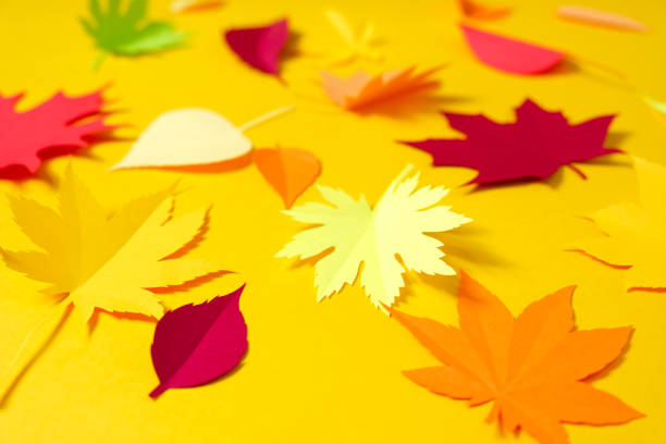 istock Leaves of paper fall red, orange, yellow leaf fall. 1158872465