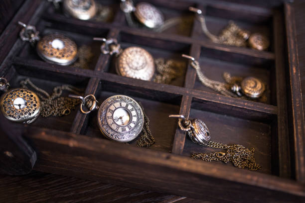 istock Many old pocket clock on wooden desk 1158872649