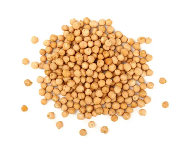Close up heap of dried chickpea beans (Cicer arietinum) isolated on white background, close up, elevated top view, directly above