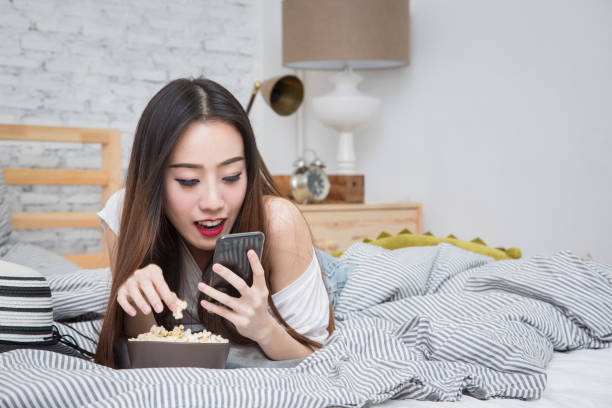istock Young Asian girl working at home 1158873890