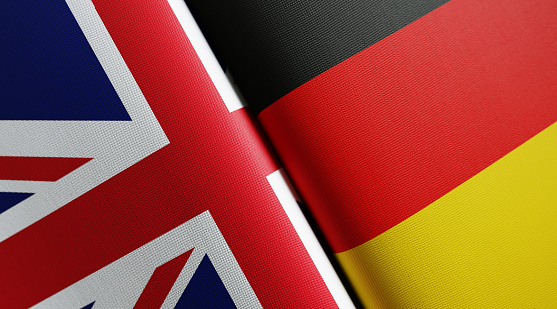 British and German flag pair. Horizontal composition with copy space and selective focus.