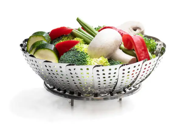 Fresh  raw vegetables in steam basket. Ready for cooking.