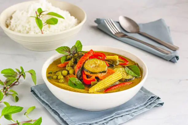 Vegan Thai Green Curry with Rice, Garnished with Thai Basil, Asian Food Photography. Traditional Thai Food Photography"n