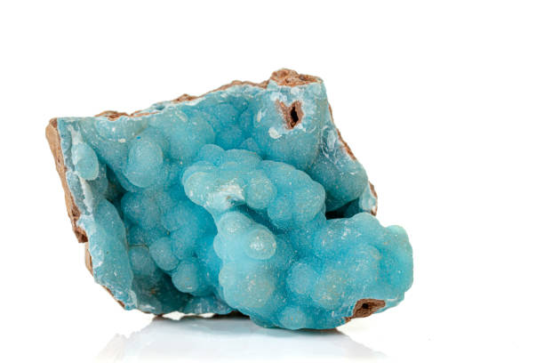 Macro pink Smithsonite mineral stone on microcline on white background close up