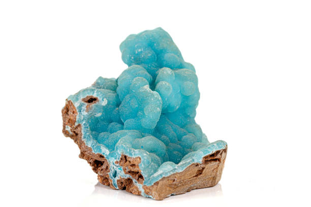 Macro pink Smithsonite mineral stone on microcline on white background close up
