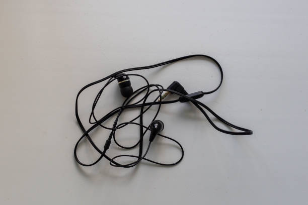 istock tangled black earphones for your phone 1158883513