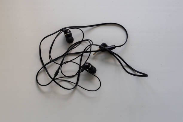 istock tangled black earphones for your phone 1158883514