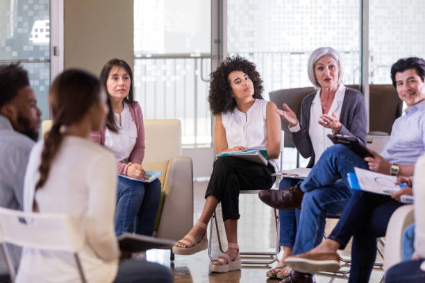 istock Entire diverse team looks to unidentified person off camera 1158889503