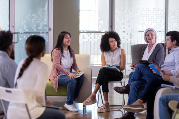 istock Mid adult male shares a problem during meeting 1158889589