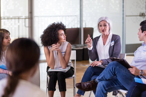 istock Mature adult Caucasian female gestures while making a point 1158889591