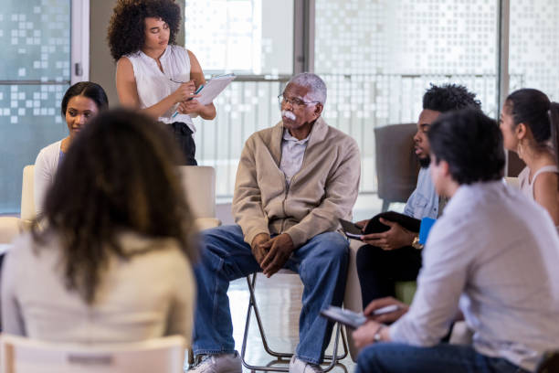istock Diverse community group meets to discuss new laws 1158889597