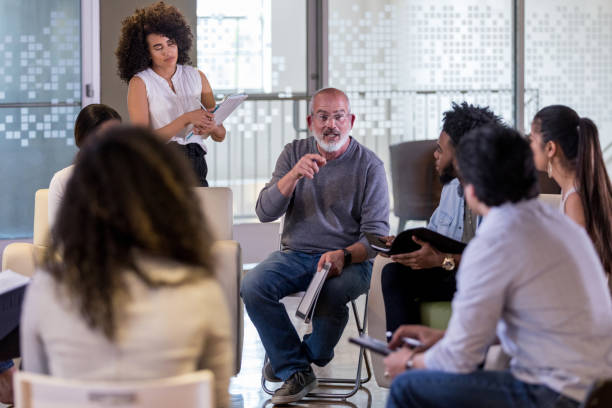 istock Diverse homeowners group listens as president explains new policies 1158889599