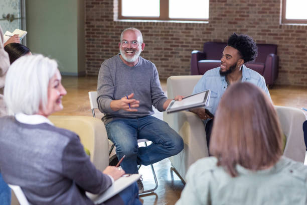 istock Diverse neighbors share a lighthearted moment during meeting 1158889677