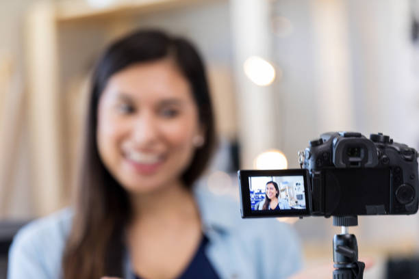 istock Foreground focus of woman on digital camera screen 1158889692