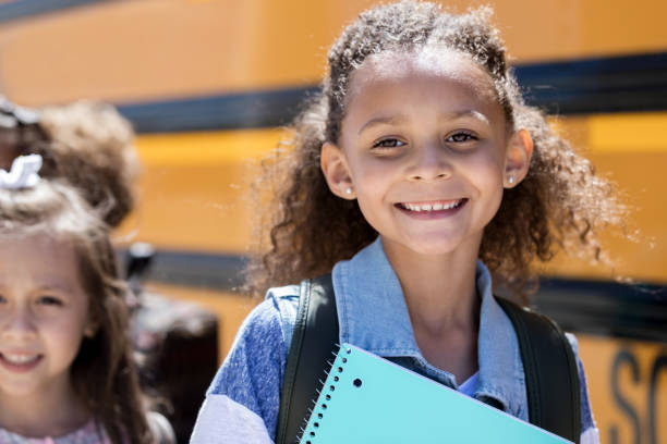 istock Adorable mixed race schoolgirl 1158889821