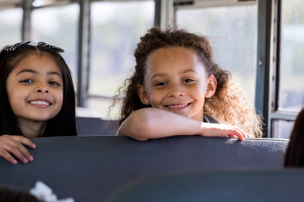 istock Young girls on school bus 1158889835