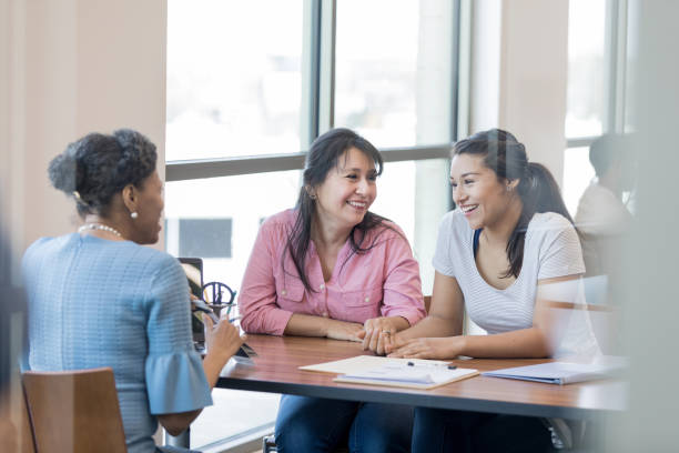 istock Multi-ethnic group engage in conversation of starting a bank account 1158890147
